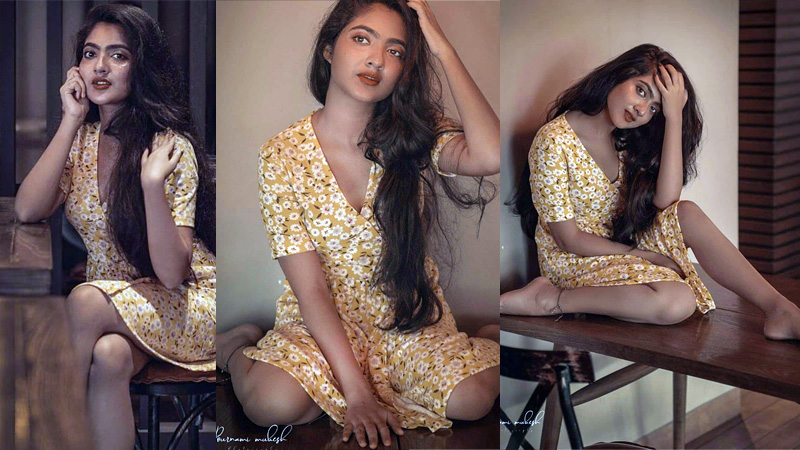 You can see Nandana Varma and photoshoot pictures shining in golden color